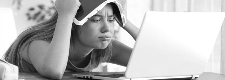 woman frowning at a computer